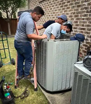 The Five Star Heating & A/C crew working on a customer's AC repair.