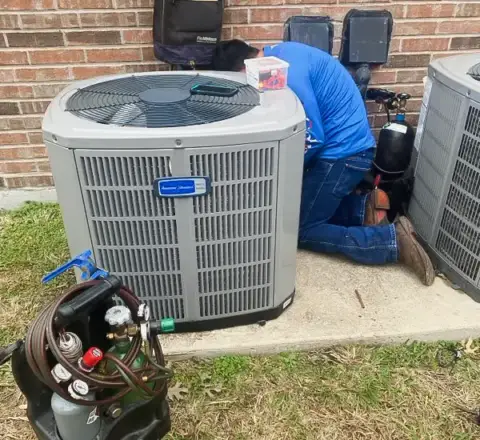 A Five Star Heating & AC crew member doing maintenance on a customer's unit.