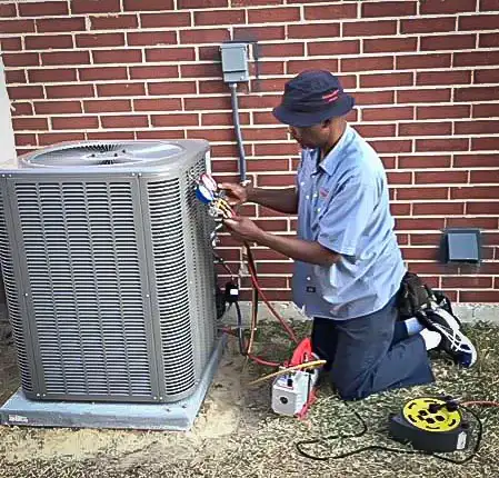 Our owner, D'Marcicus Childress, performing Five Star service on a customer's AC repair